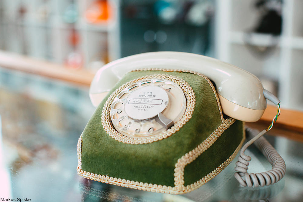 vintage phone with elaborate velvet cover 