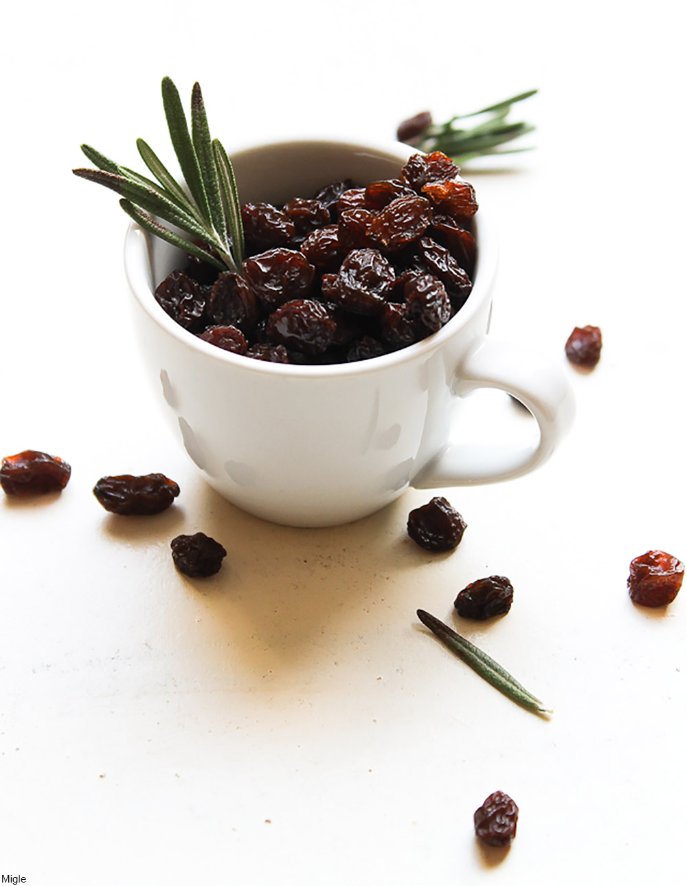 raisins and rosemary in a mug