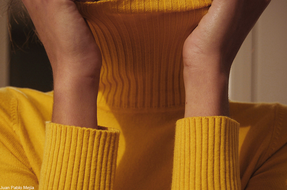 woman in a yellow sweater
