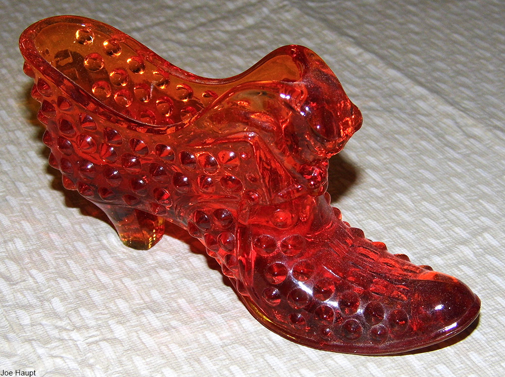 orange Fenton hobnail glass shoe with cat head