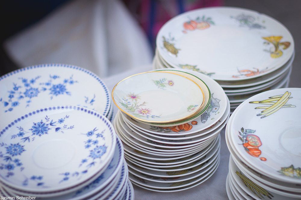 stacks of china plates of various patterns