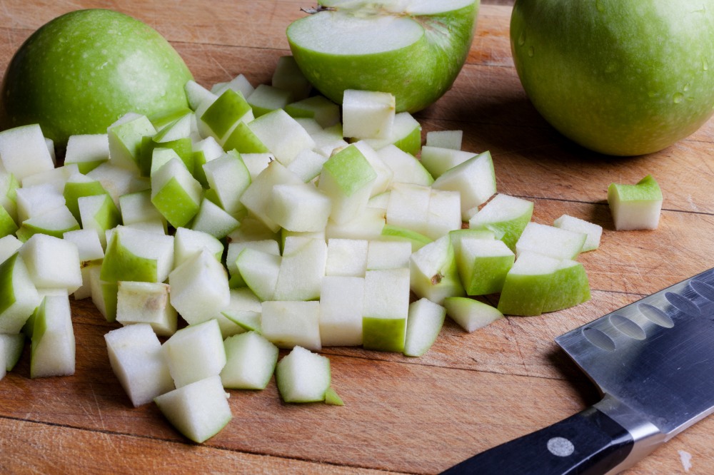 diced granny smith apples on cutting board