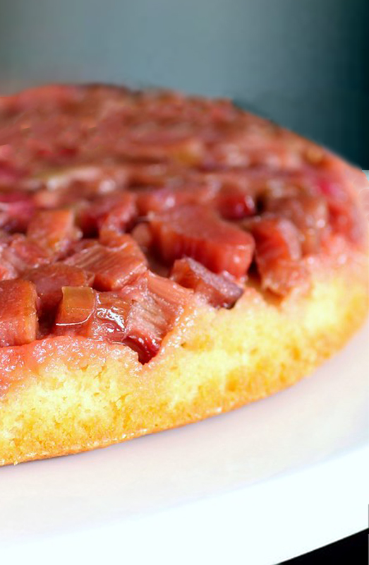 Vertical photo closeup of strawberry rhubarb upside down cake round