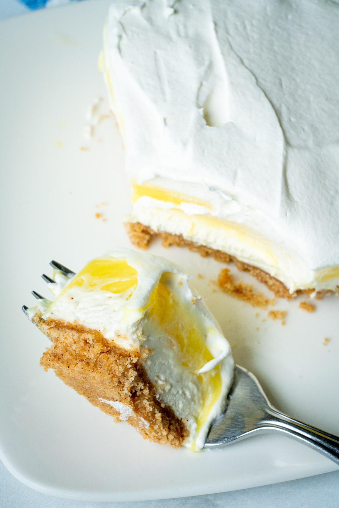 Bite of lemon lush on a fork